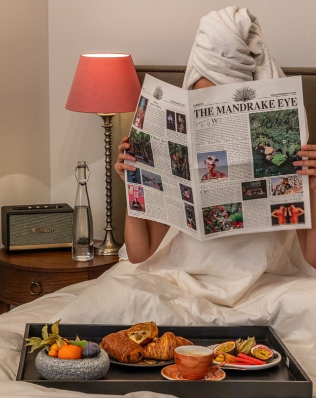 Lady reading The Mandrake newspaper