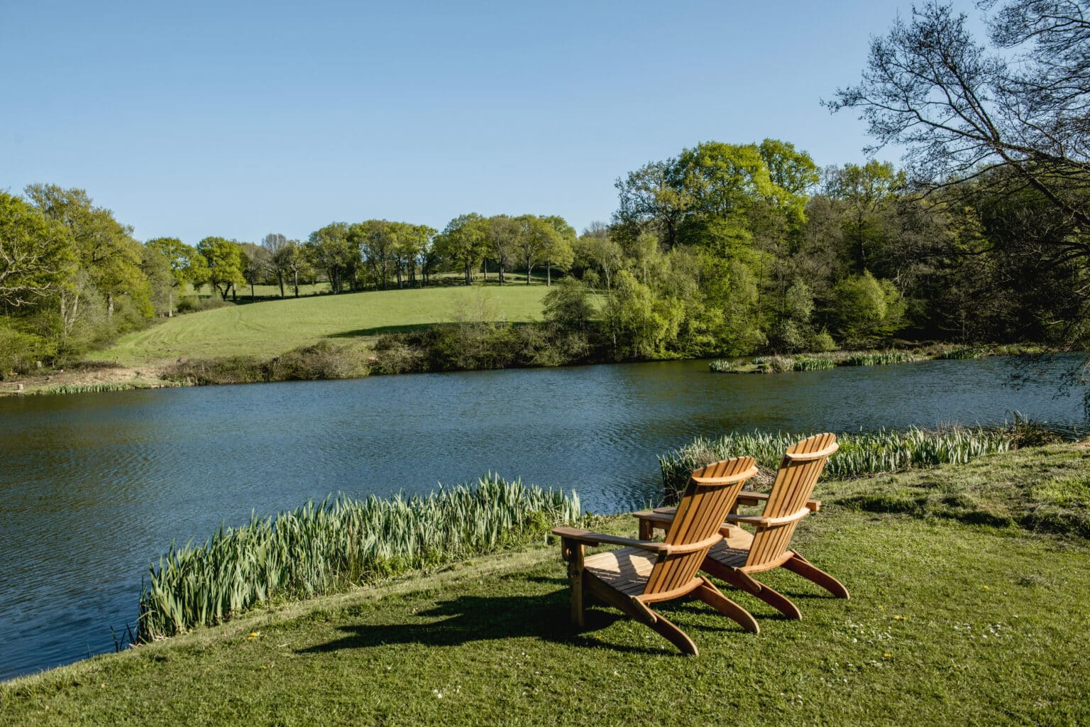 Two seats by a lake