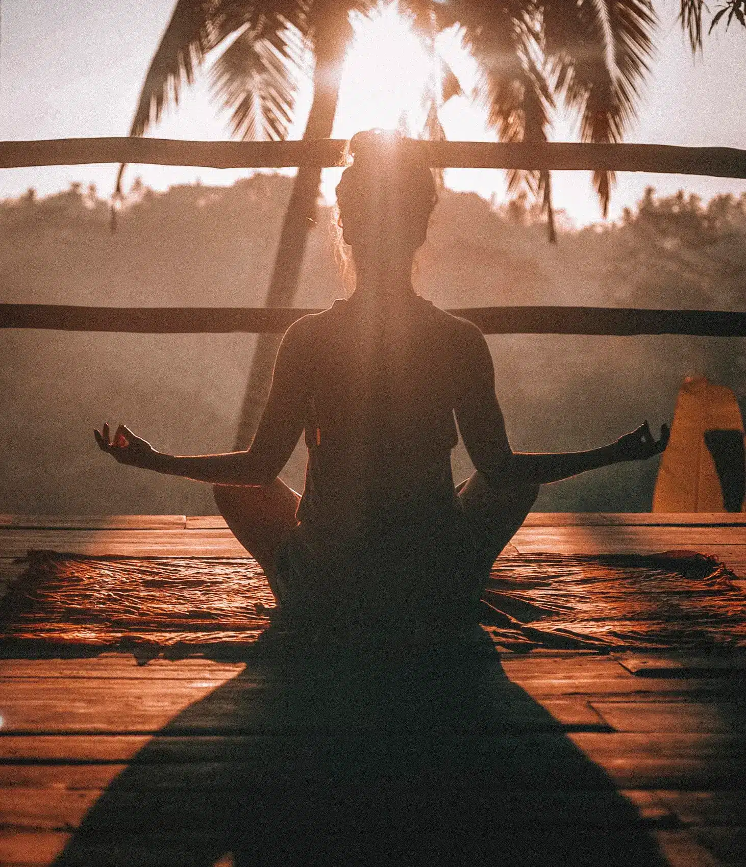 Lady doing yoga at sunrise